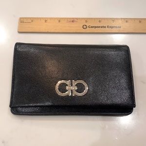 Salvatore Ferragamo. Wallet clutch with adjustable strap. Great condition.